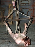She's tied in a simple elbow to neck strangle tie, a hogtie, a three-point suspension