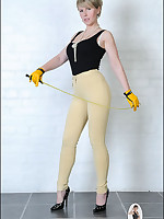 Mistress poses in tight yellow riding pants