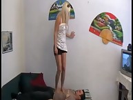 A nyloned woman plays a foot game