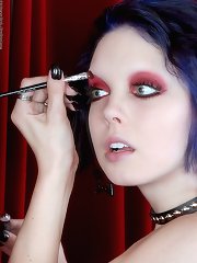 goth chick putting on makeup black panties