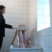 Shameful bare bottom paddling for naked guy in the shower room